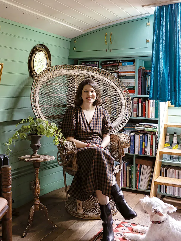 From this angle, teal walls and warm wood floors. Boho bits everywhere.