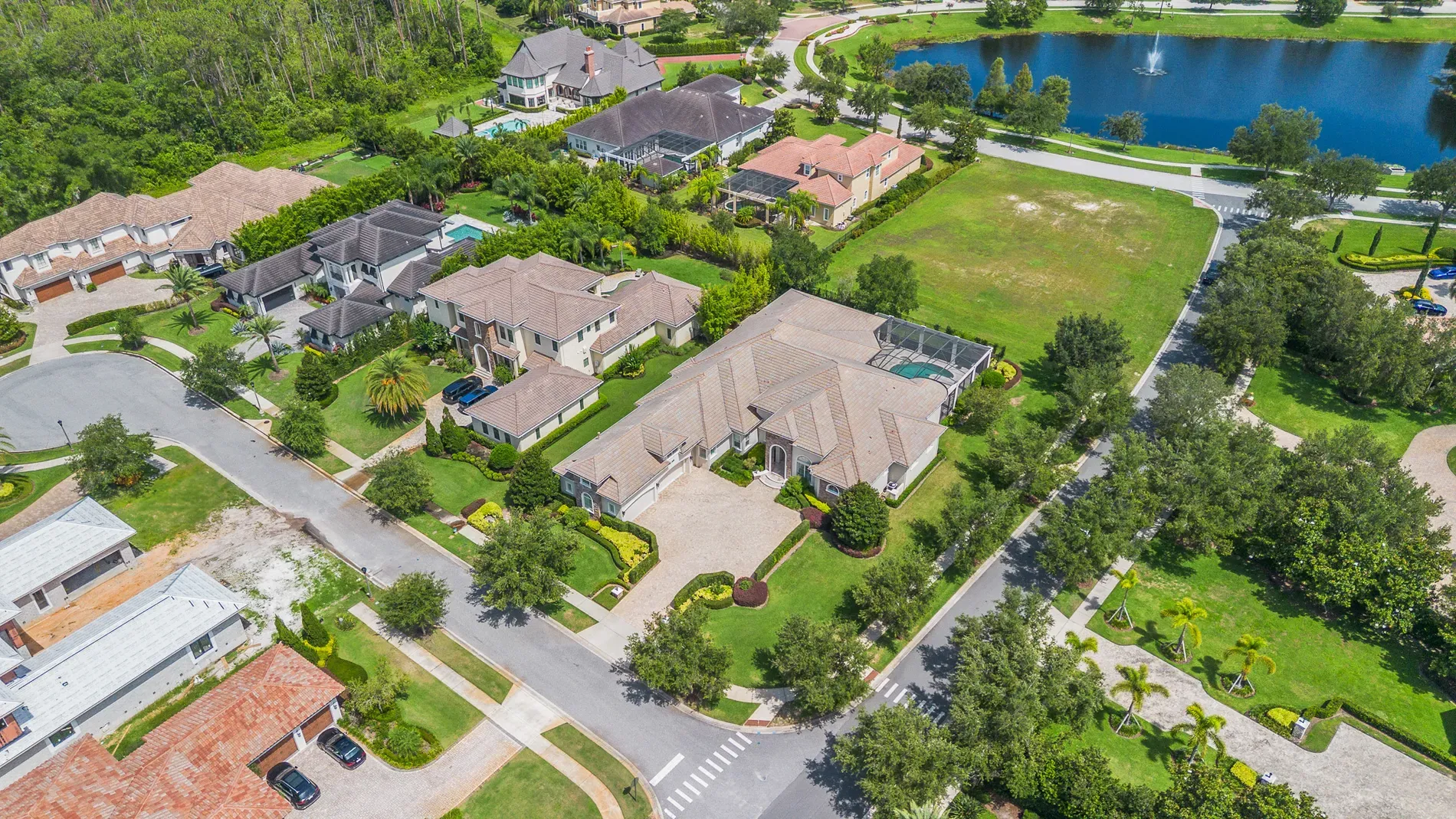 Back outside—cul-de-sac curves, palms everywhere. Resort neighborhood energy.