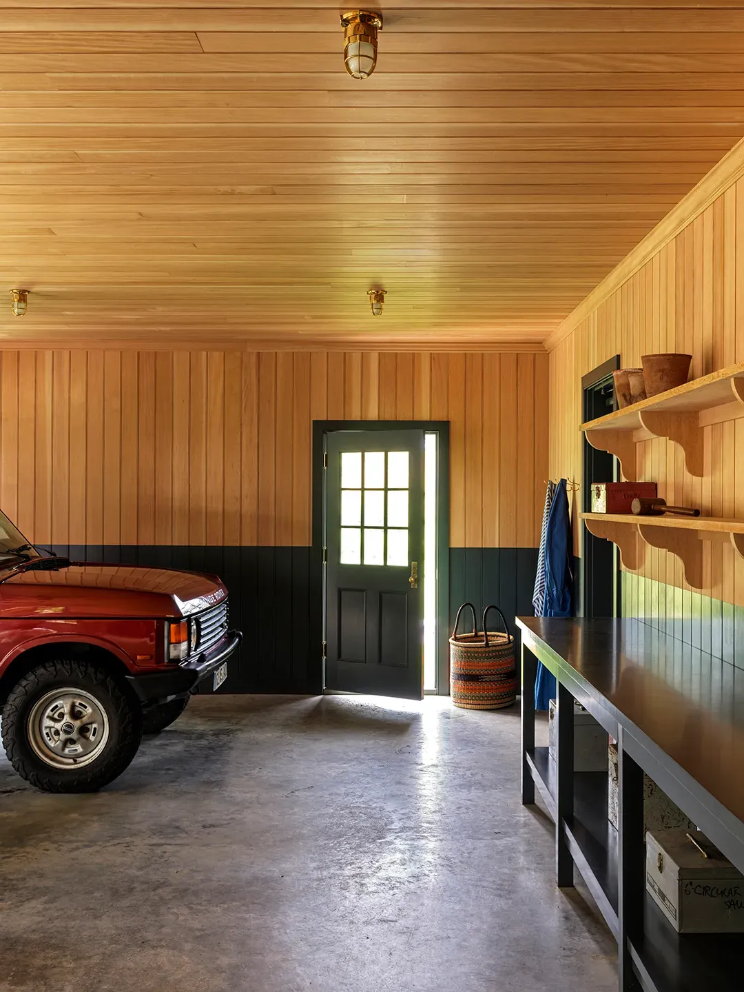 Garage glows with wood paneling. Functional, but almost too pretty to park in.