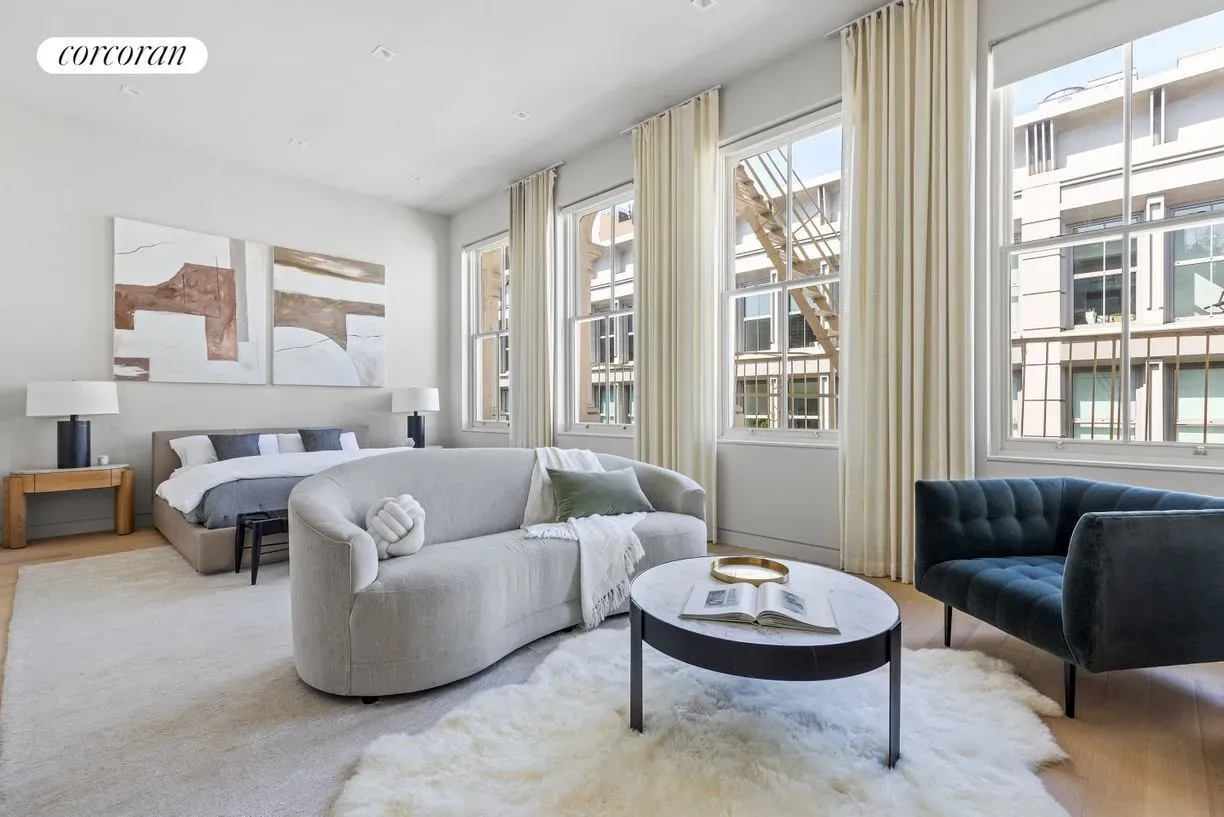 Urban view of fire escapes. High ceilings, soft walls—loft vibes without chill.