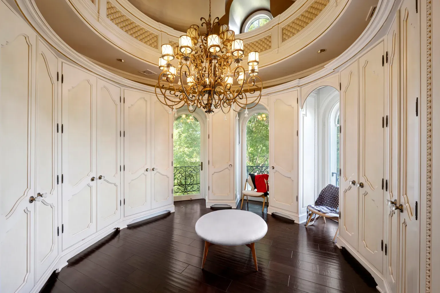 Here's the round room—white built-ins hugging the curve. Very tailored.