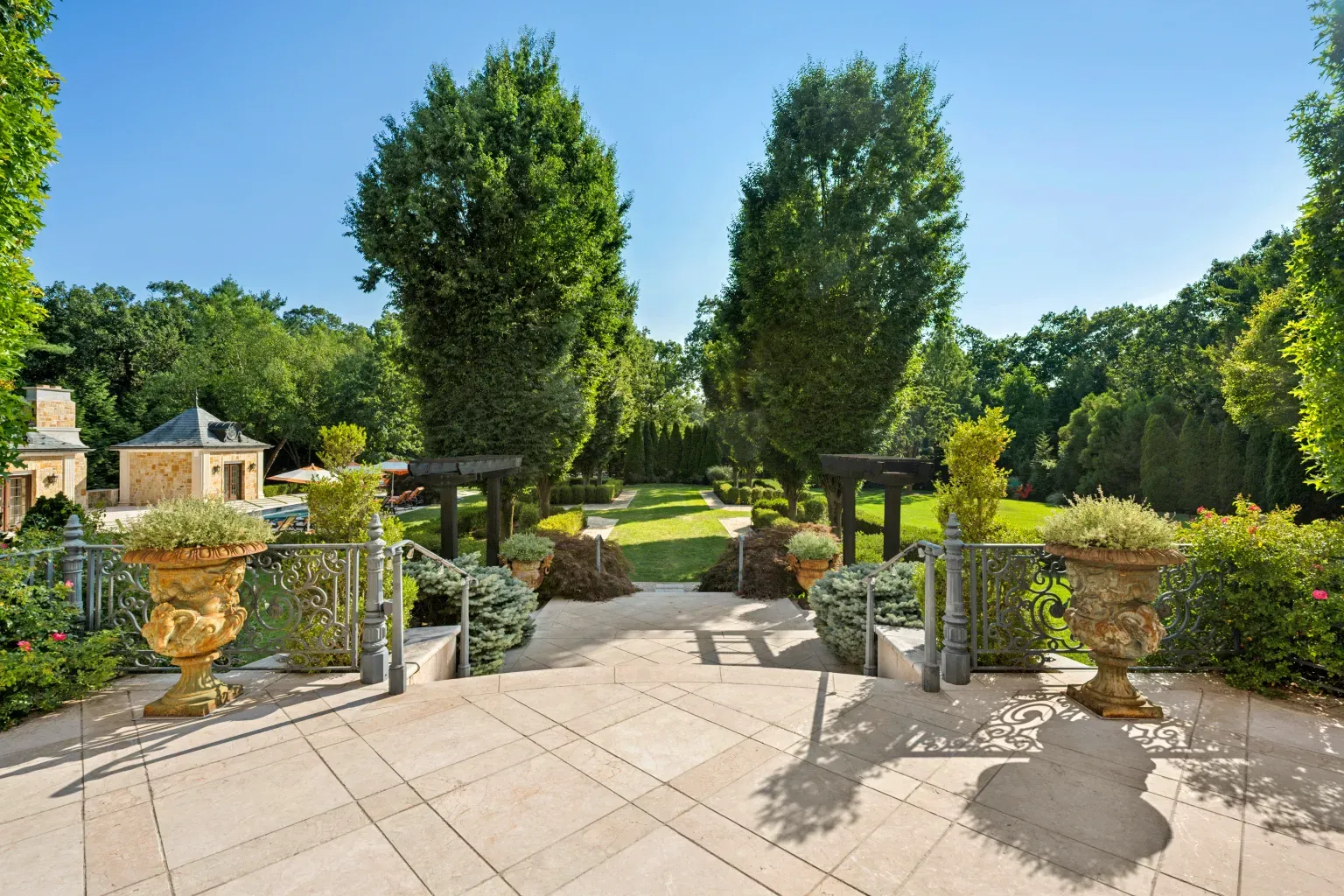 Gilded planters and creamy stone path. Fancy, maybe a bit extra?
