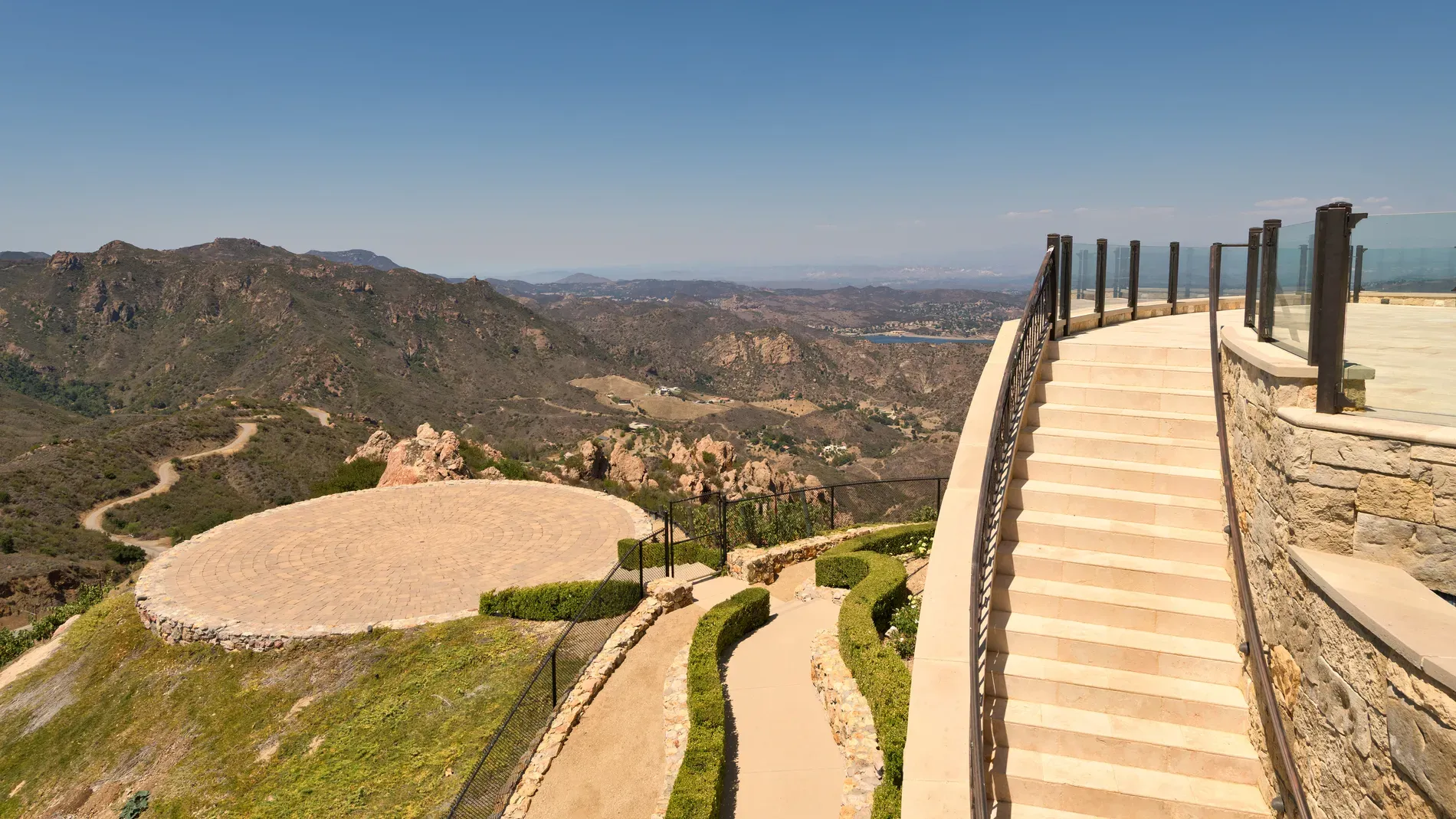 Okay, this curved stone staircase—super smooth. From this angle, it really invites you.