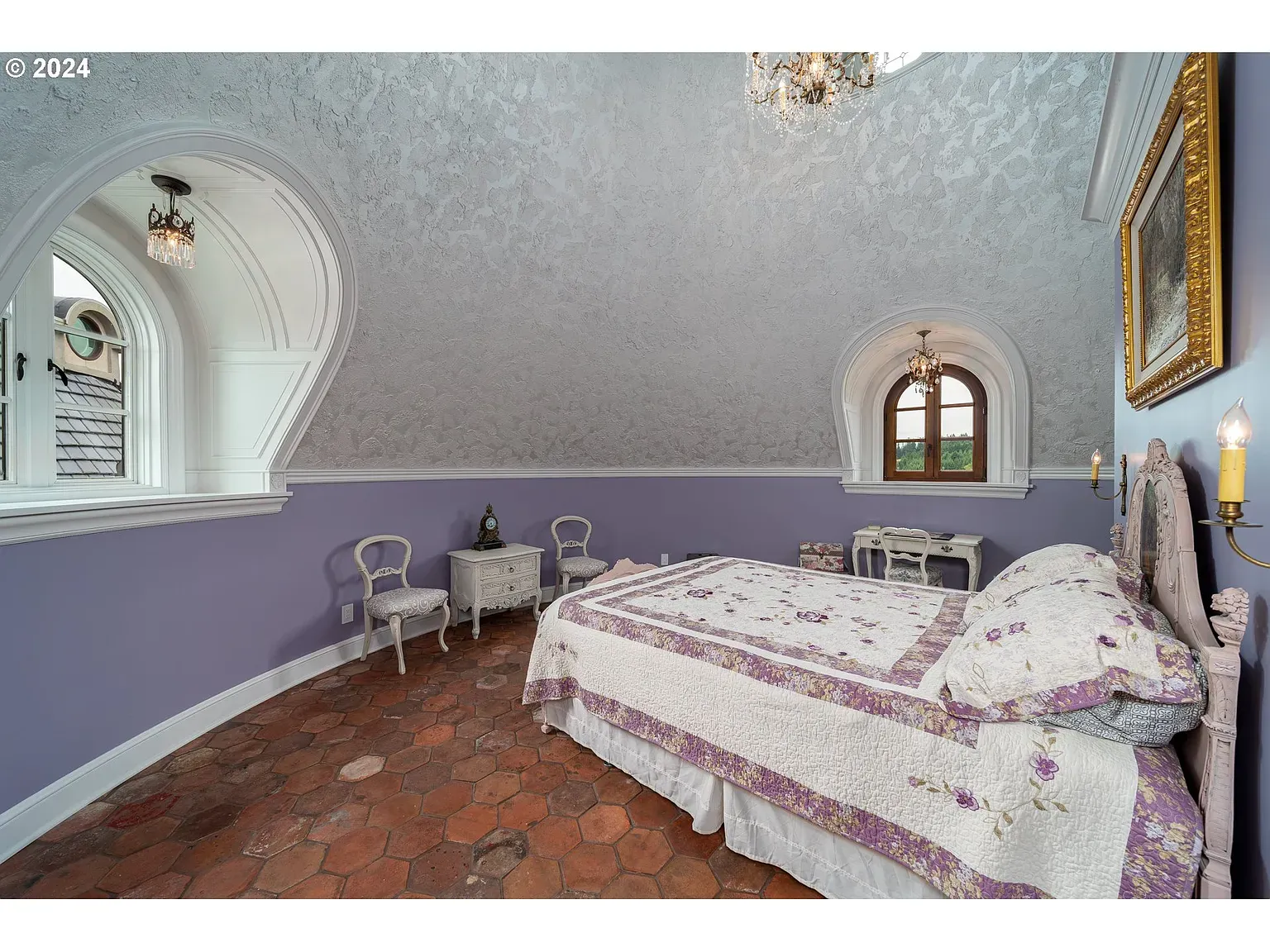Lavender bedroom glow, textured walls, arches. Feels dreamy without being sugary.
