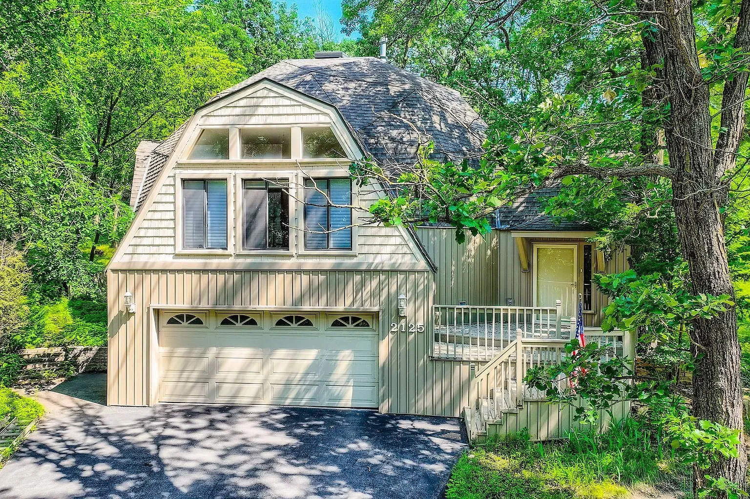 Back outside—A-frame with a swoopy shingled roof. Why the swoop so low?