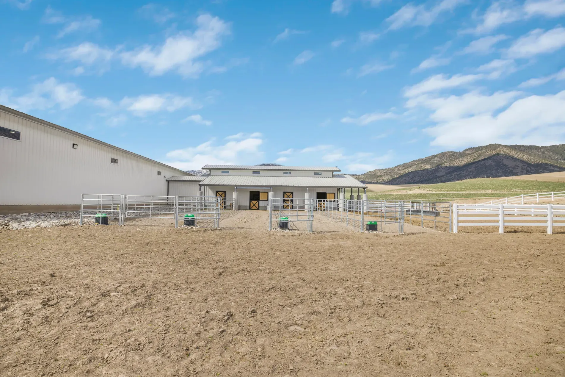 Here’s the barn — white metal, super clean. Feels spaceship for horses.