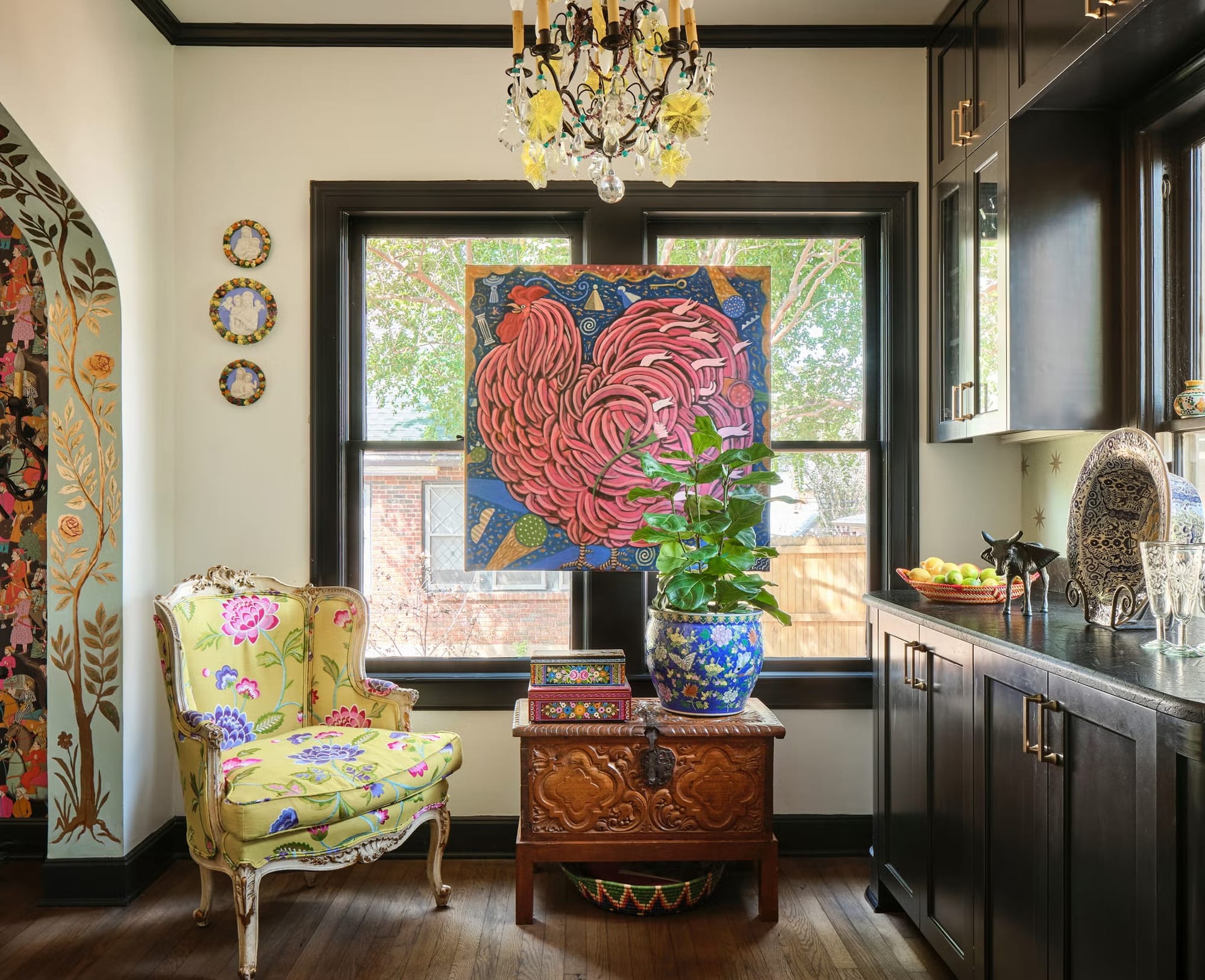 Big black casement window stealing the show. Left-side ornament—antique or replica?