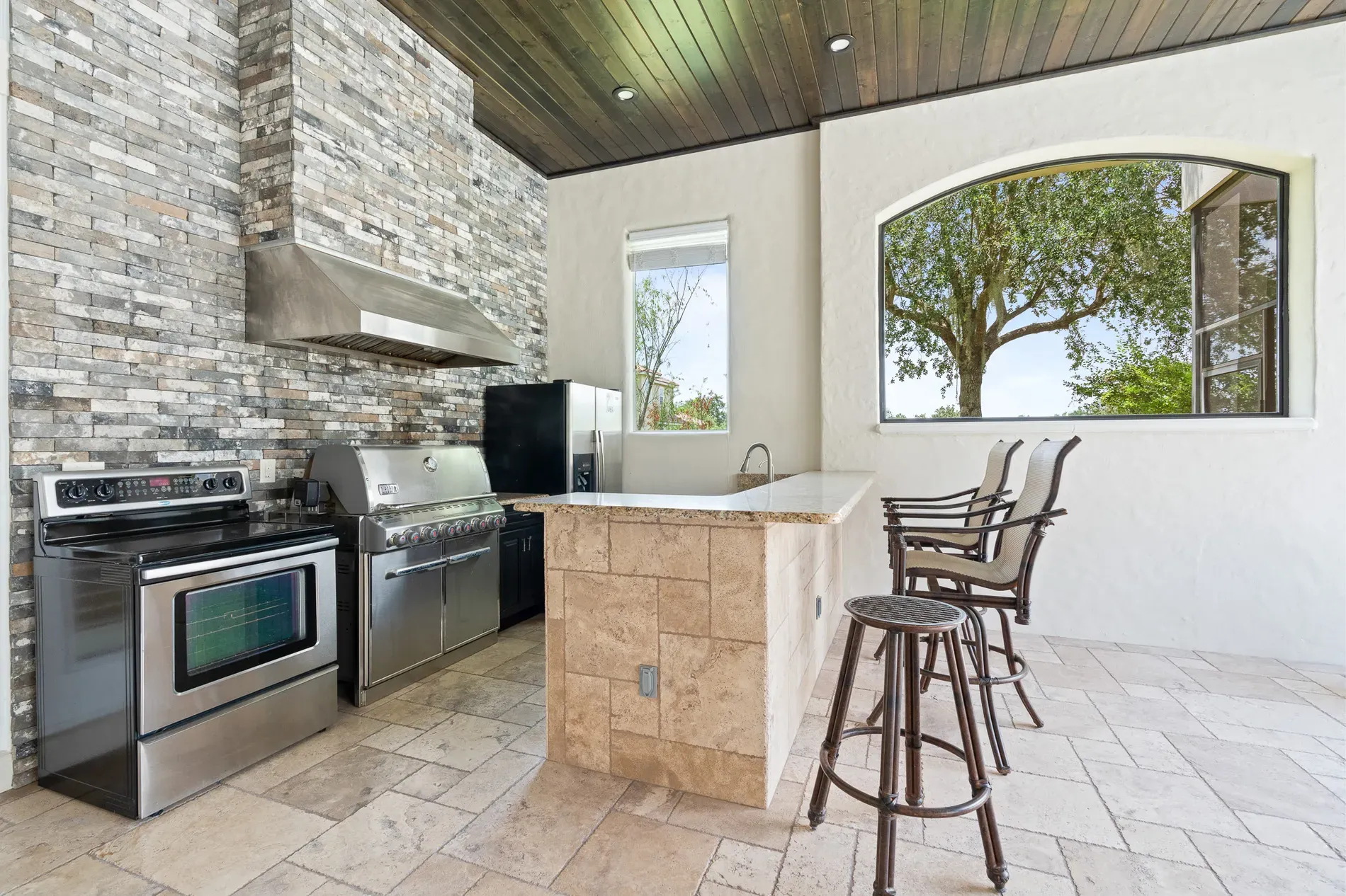 Outdoor kitchen goals. stainless everywhere, grill and range ready. Who’s cooking?