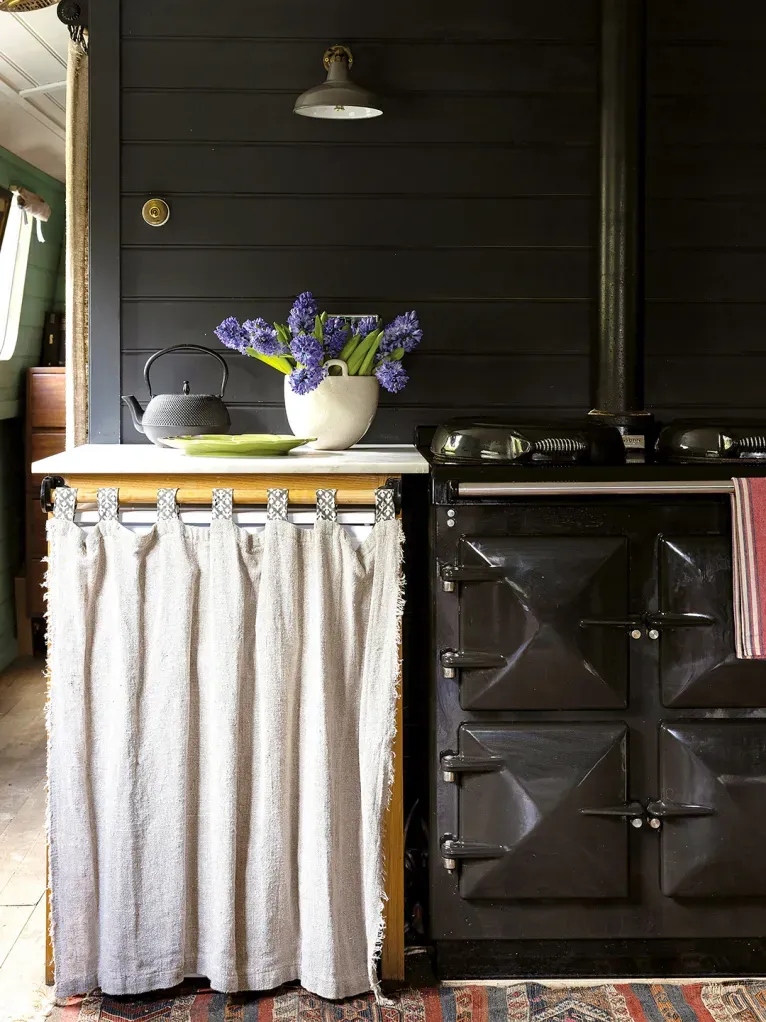 Back to the kitchen — big black AGA stealing the show. Worth the heat?