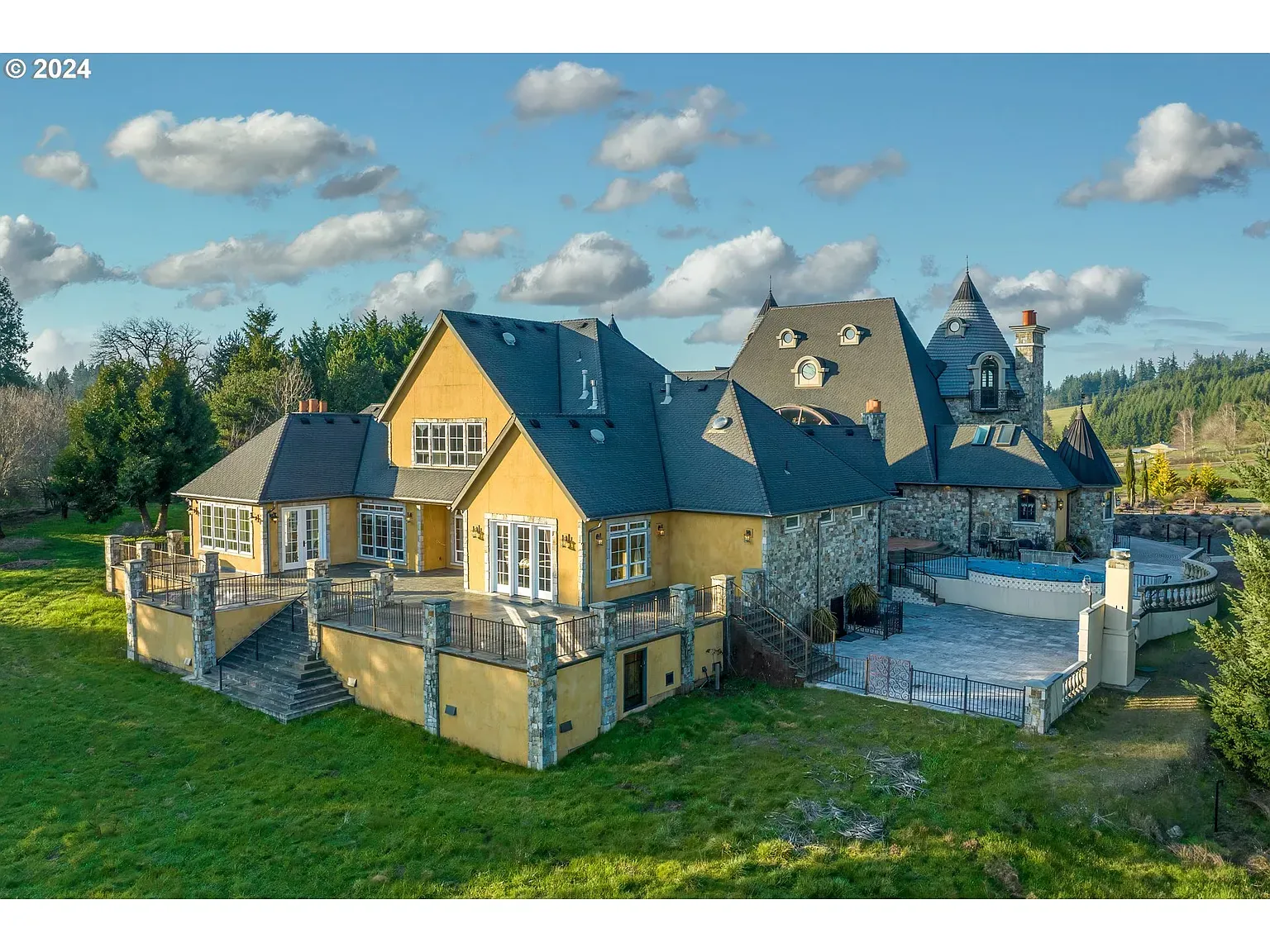 Warm yellow stucco with stone accents—cozy meets fancy. Anyone else getting Tuscan?