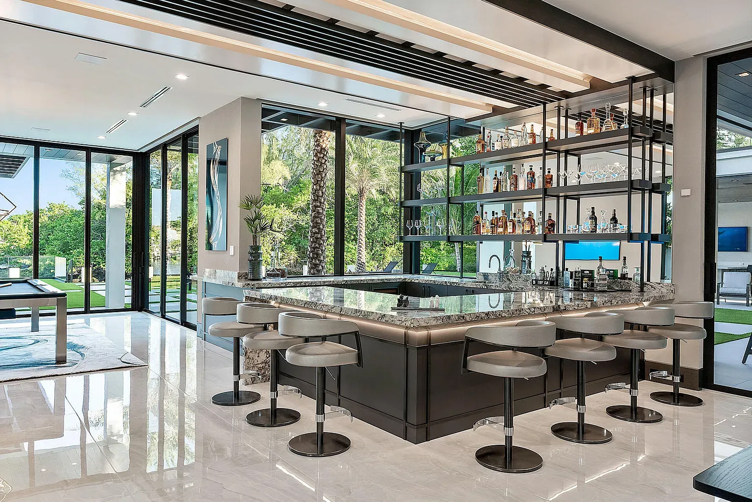 Here's the bar kitchen—huge granite island. Cooking and cocktails in equal measure.