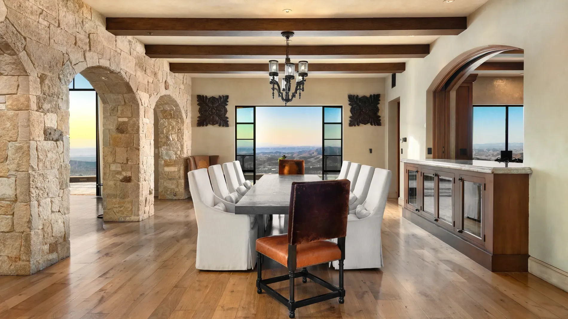 Dining room beams overhead, big table below. Feels lively without trying hard.