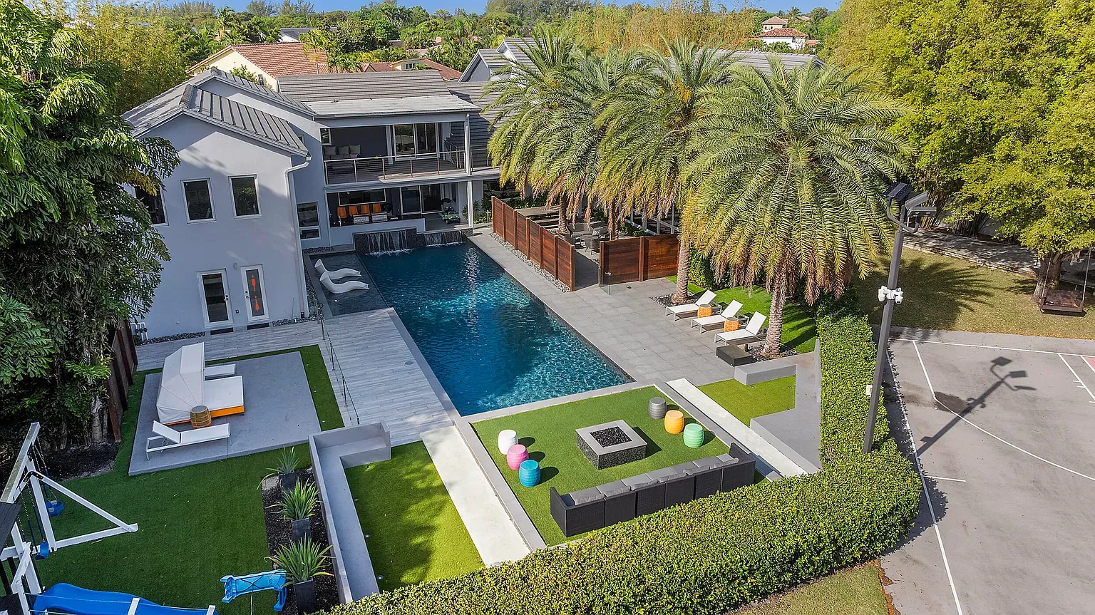 Another angle, long pool and lush edges. Resort energy, not mad about it.
