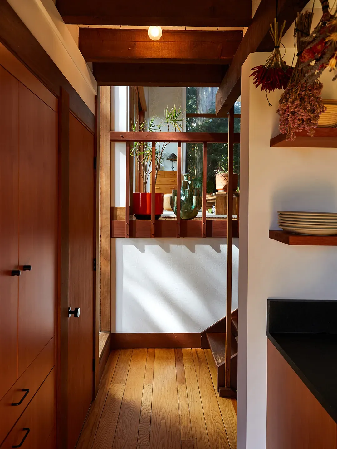 White walls, warm wood trim, glossy floors. Simple combo that just works.