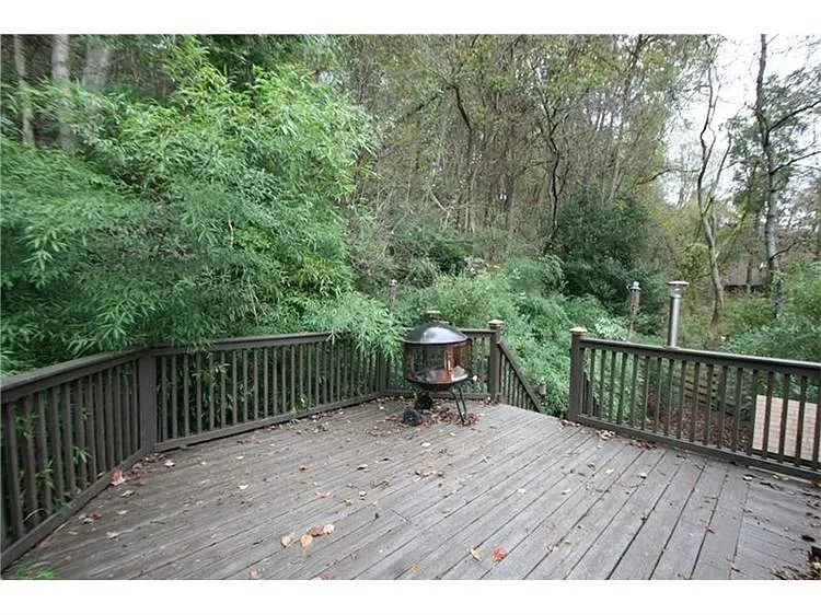 Back outside, big deck. Nicely weathered. Do we oil it or let it gray?