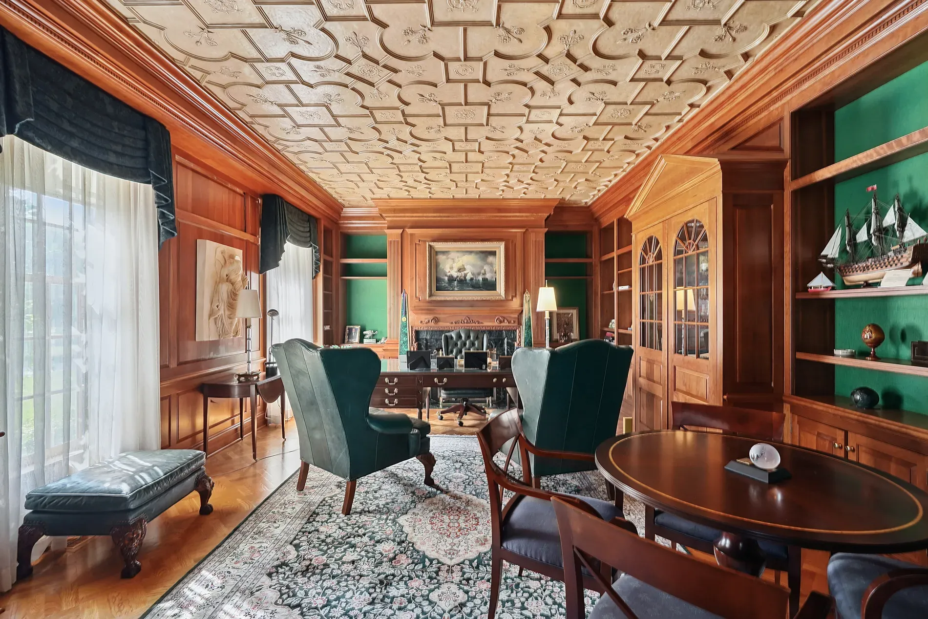 Study goes full mahogany — paneled walls, coffered ceiling, very clubby, smells books.