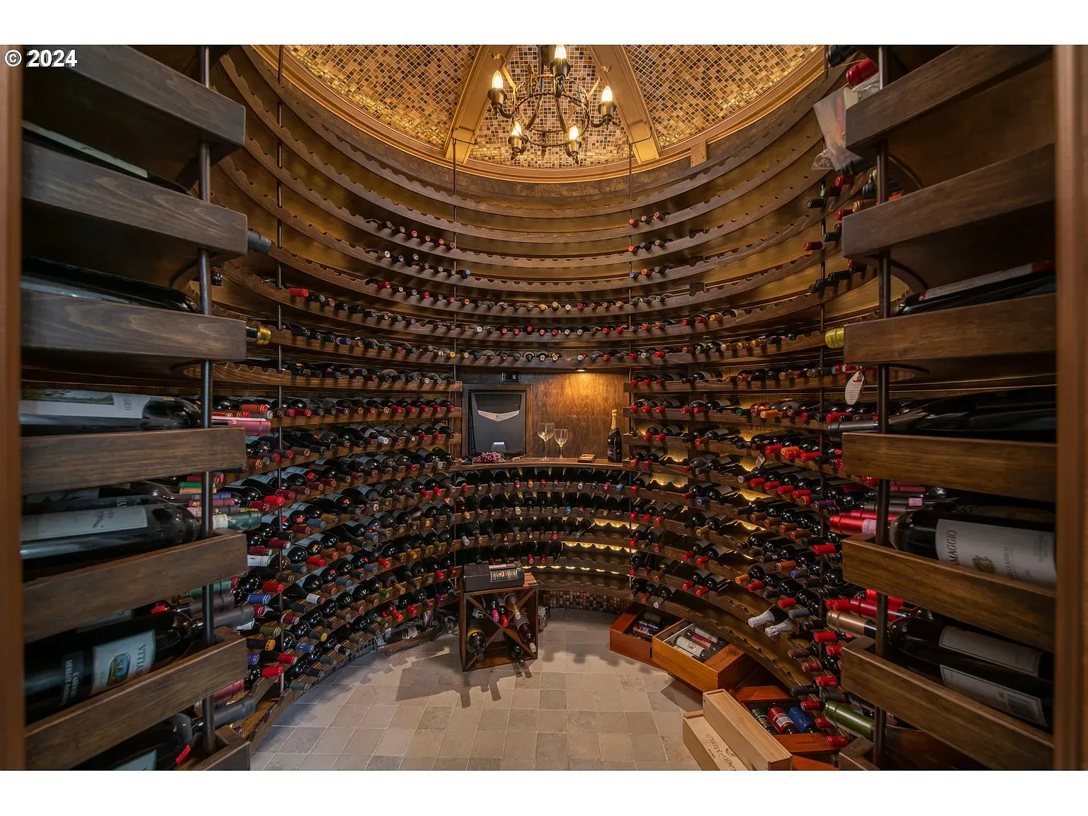 Circular wine cellar. Dark wood everywhere. I’d get lost alphabetizing vintages.