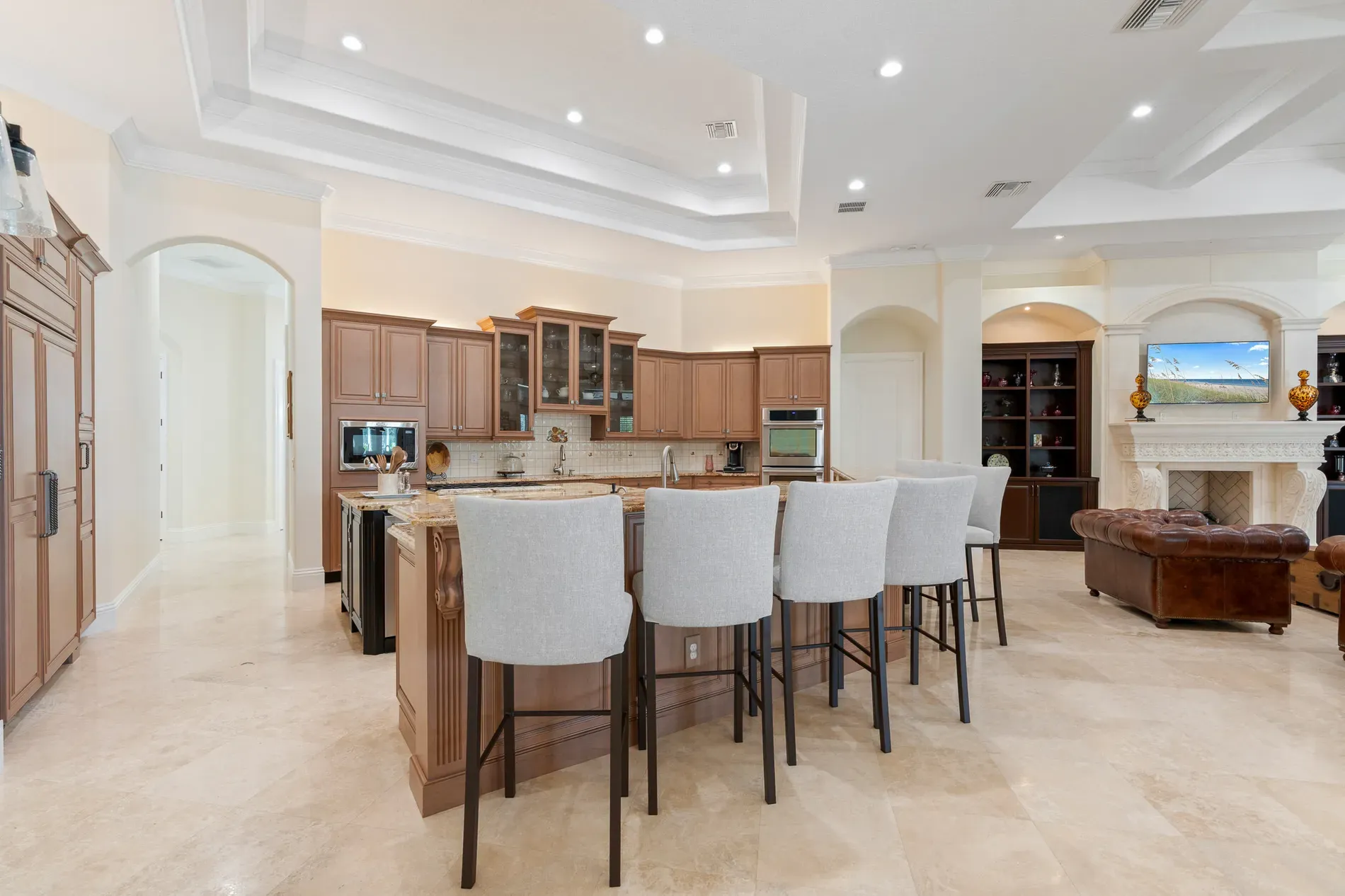 Big island energy. Detailed cabinets, light counters. Not sure about the corbels?