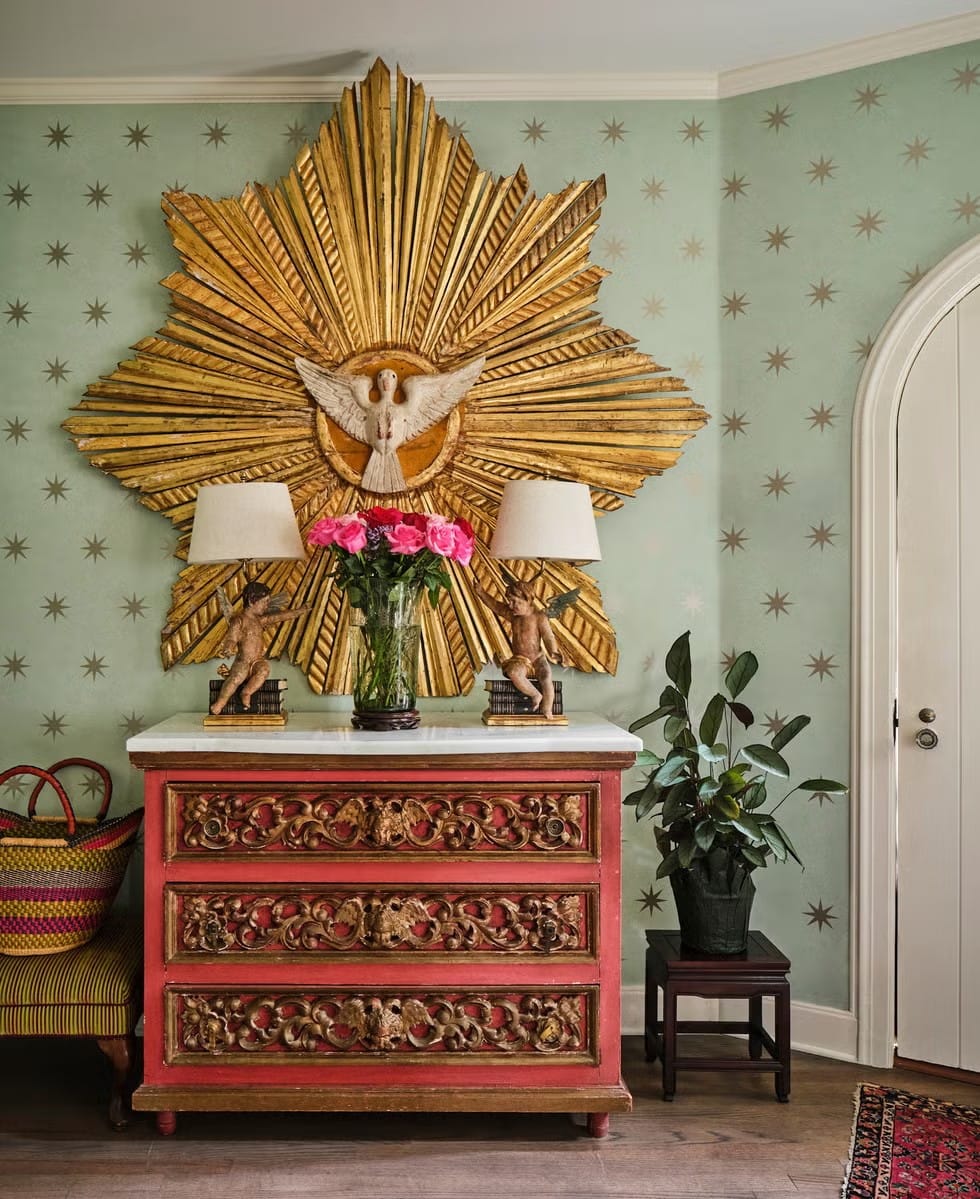 Back at the entry—gold sunburst with a dove. Dramatic. Art or altar?