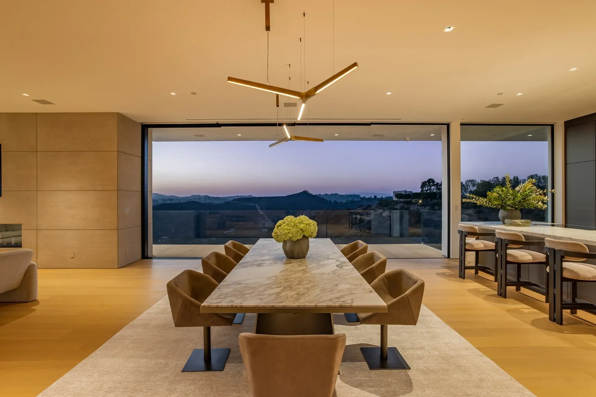 Here's the dining setup — marble runway table, chairs that dare you to spill.