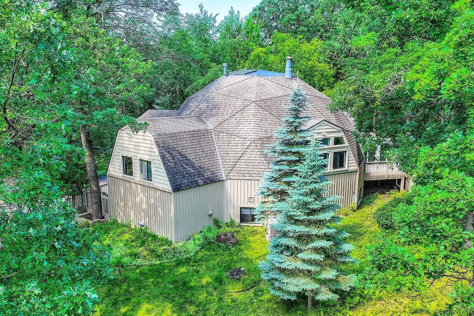 Here's the dome house, tucked in green. Beige against jungle vibes.