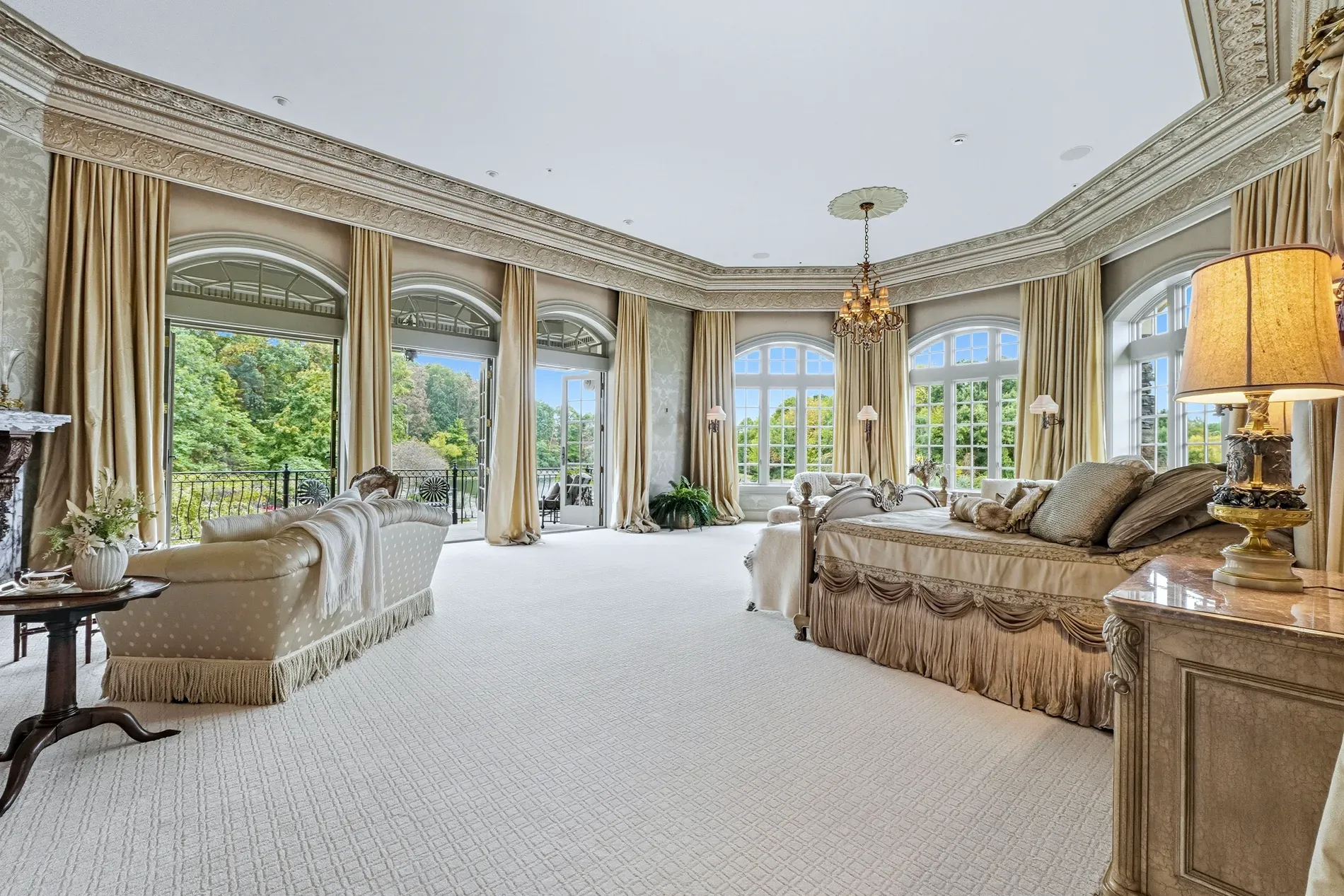 Okay, this living room—arched windows for days, drapes puddling, very magazine.
