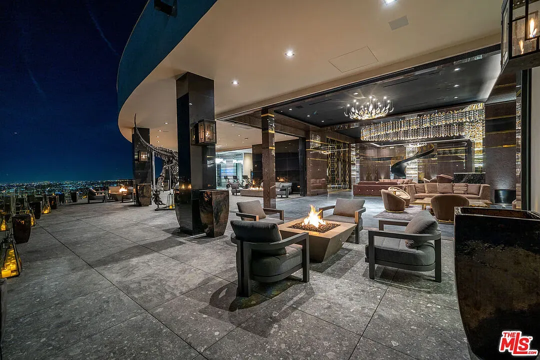 Back outside—big patio slab and that fire pit calling.