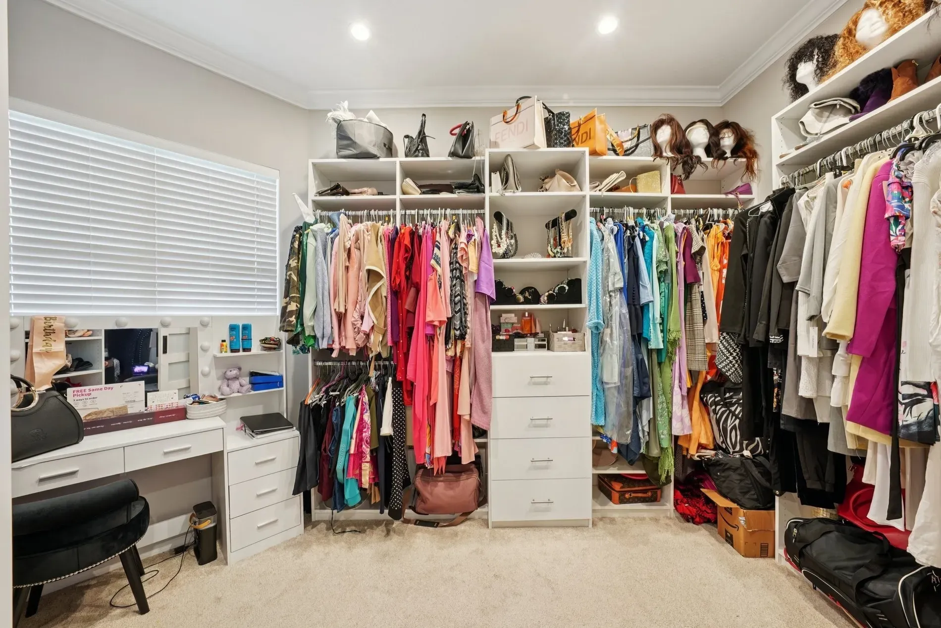 Closet rainbow on white shelves. Satisfying, but do they actually keep it this?