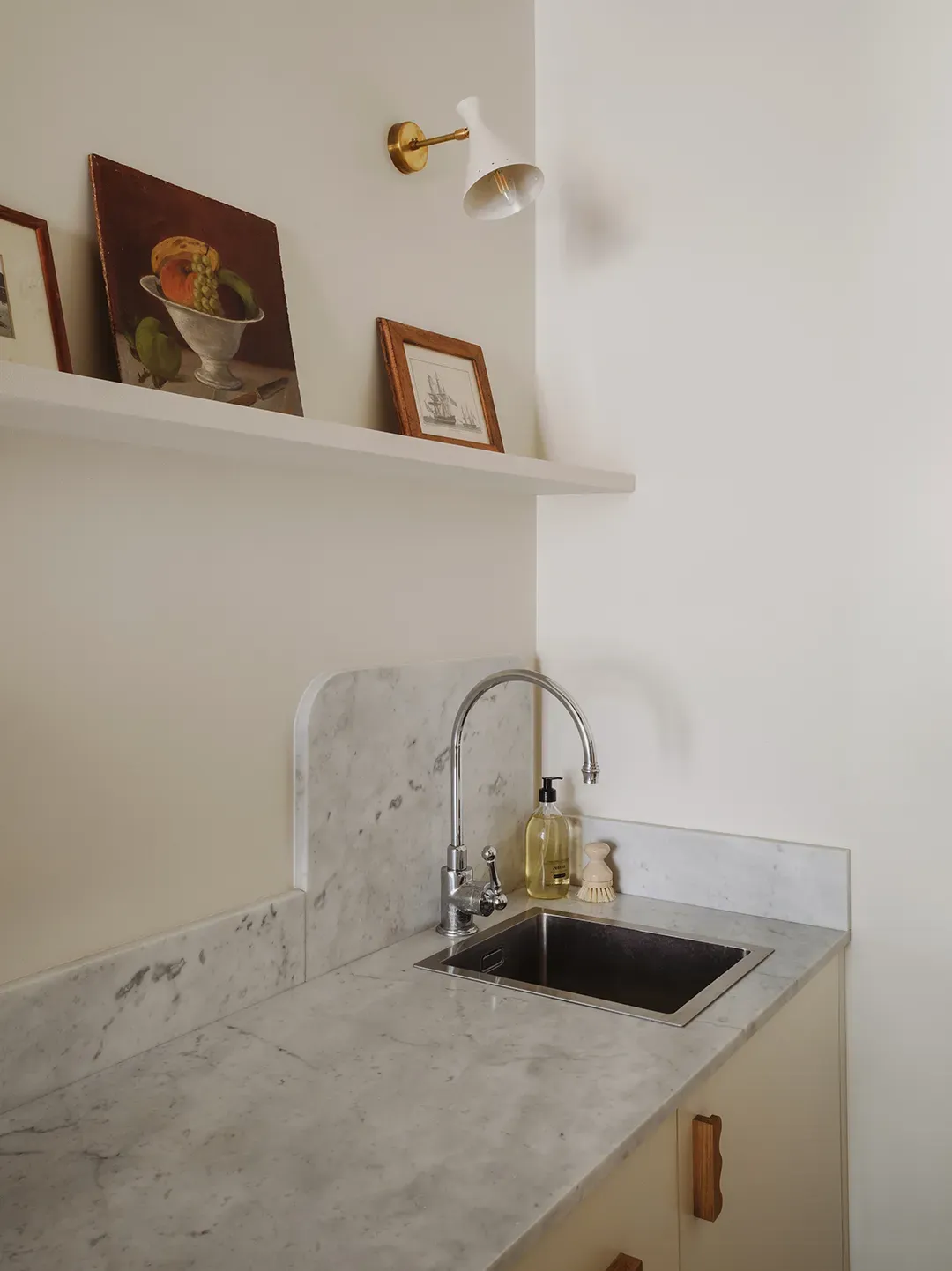 Here’s the kitchen nook — white marble, super minimal cabinets. Real marble or quartz?