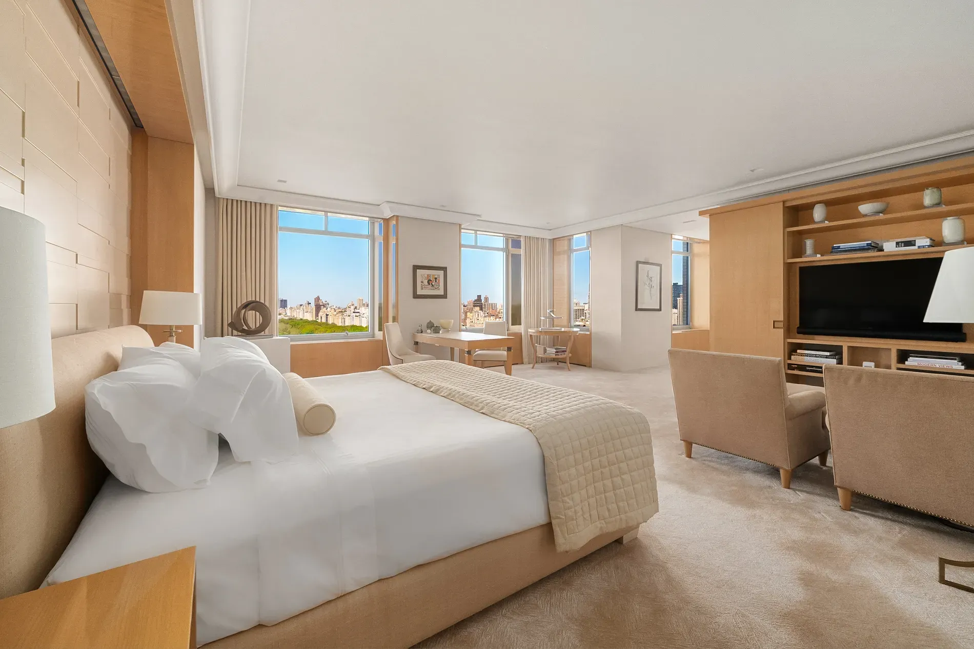 Hotel room energy in a good way. That bed looks cloud-level soft.