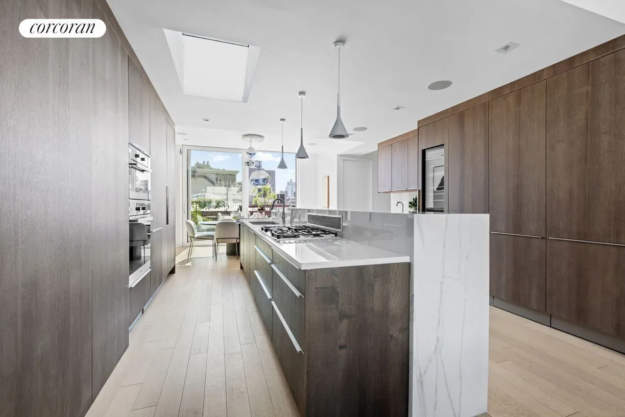 Okay, this island—polished white slab with dark wood. Not sure about this combo.