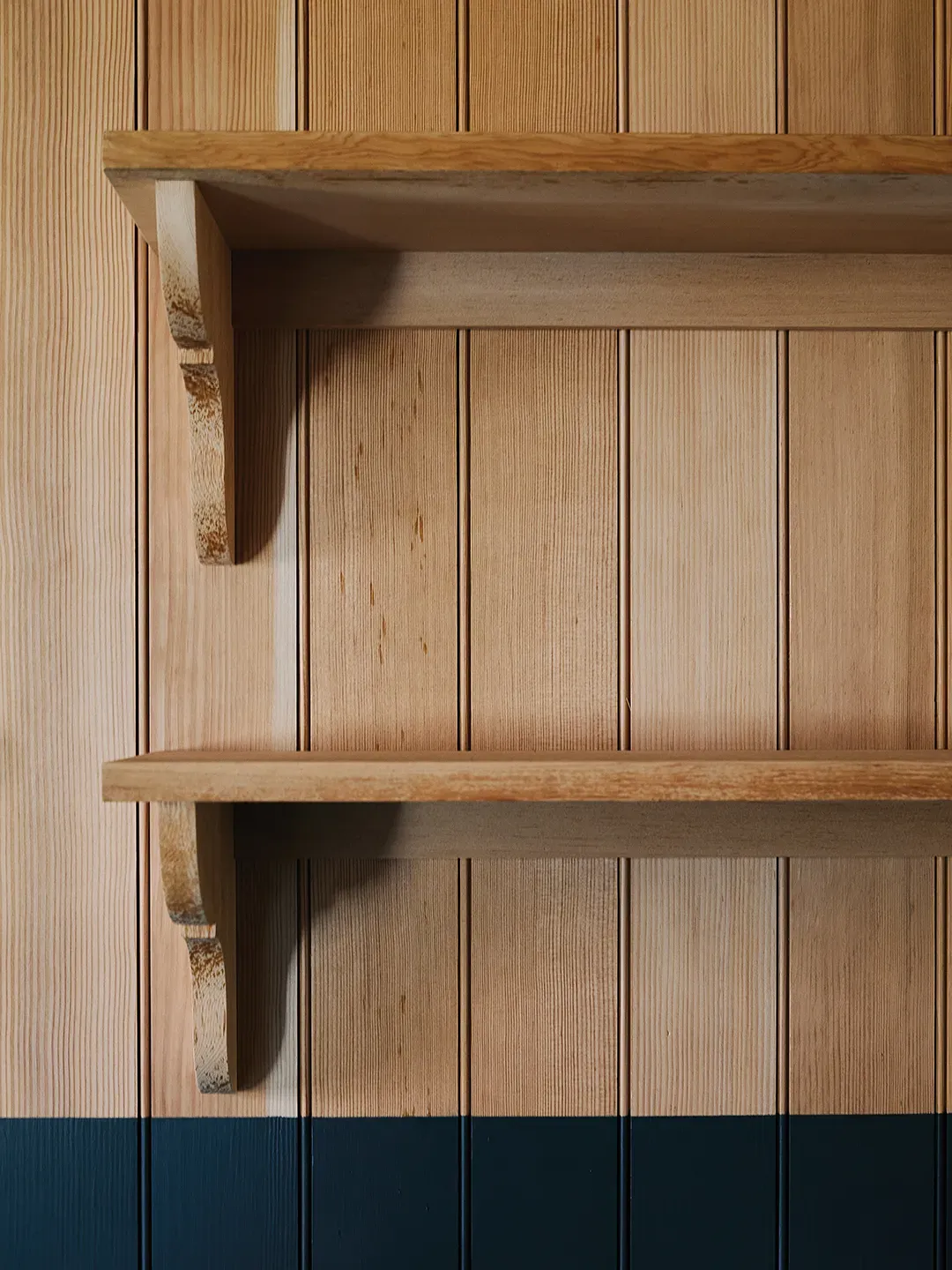 Okay, this slatted wall—honey brown and cozy. Sounds better than it looks?