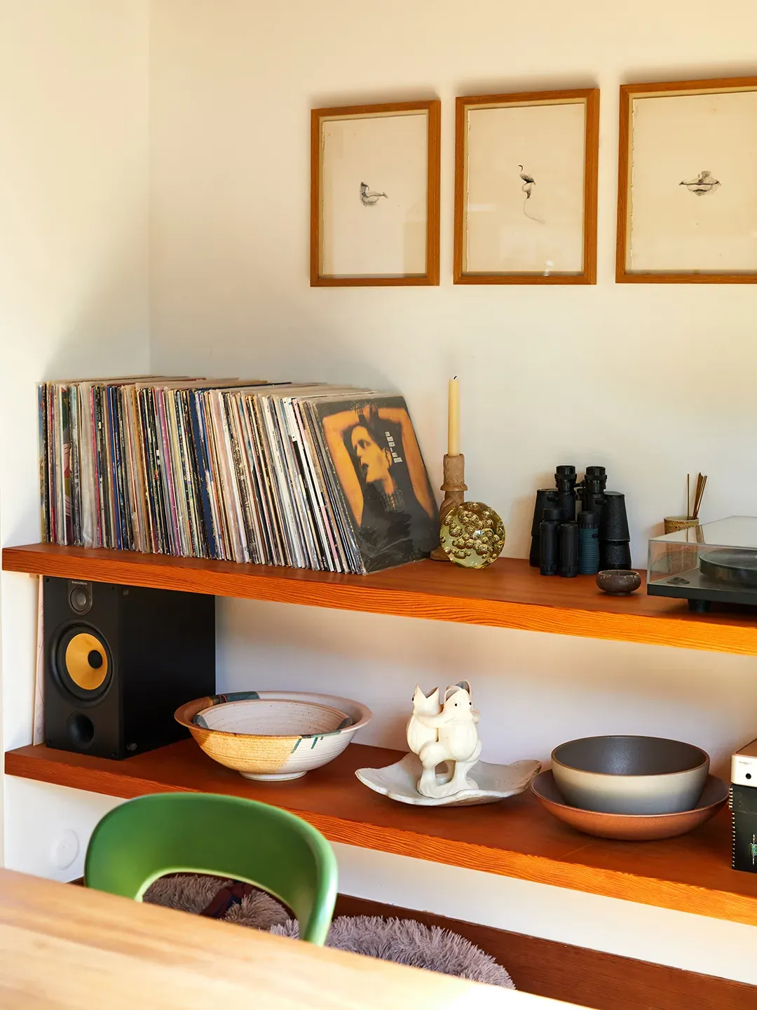 Record wall! Love the bird prints above. Vintage vibes without feeling dusty.