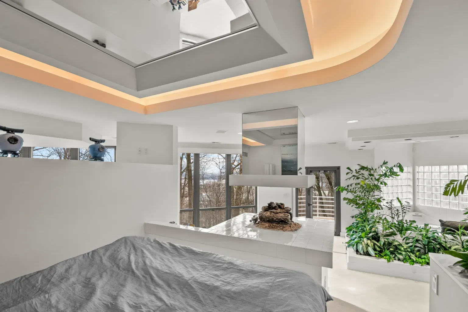 Okay, this bedroom — crisp whites, weird angles. Calming, but where’s the closet?