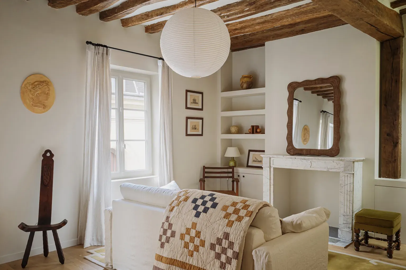 Creamy walls and big beams again. I mean, it’s cozy, just slightly dramatic.