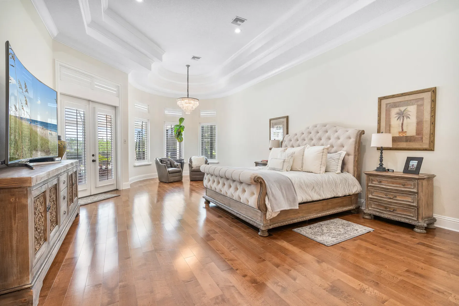 Bedroom soft and calm—tufted headboard, layers of neutrals. Easy sleep.