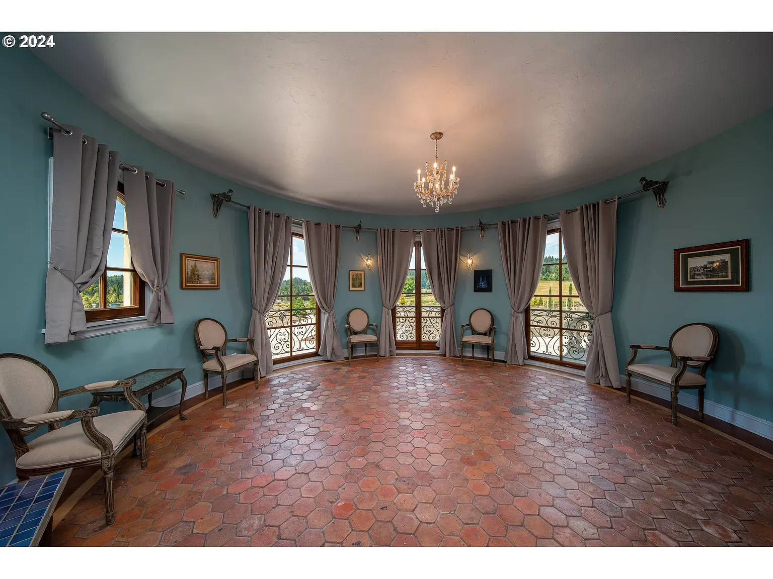 Round room again—muted blue and terracotta tiles. Feels a courtyard.