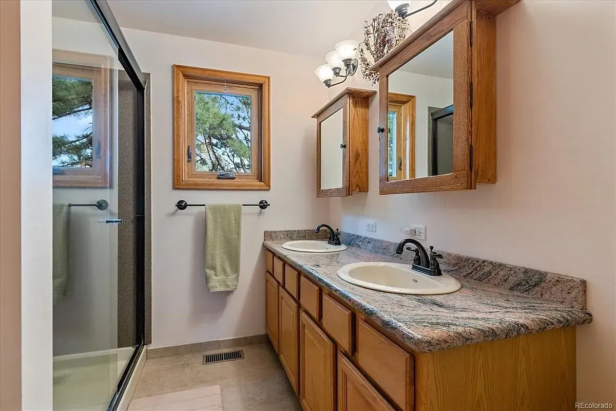 Double vanity with honey wood and granite—nice. Is the stone too shiny?