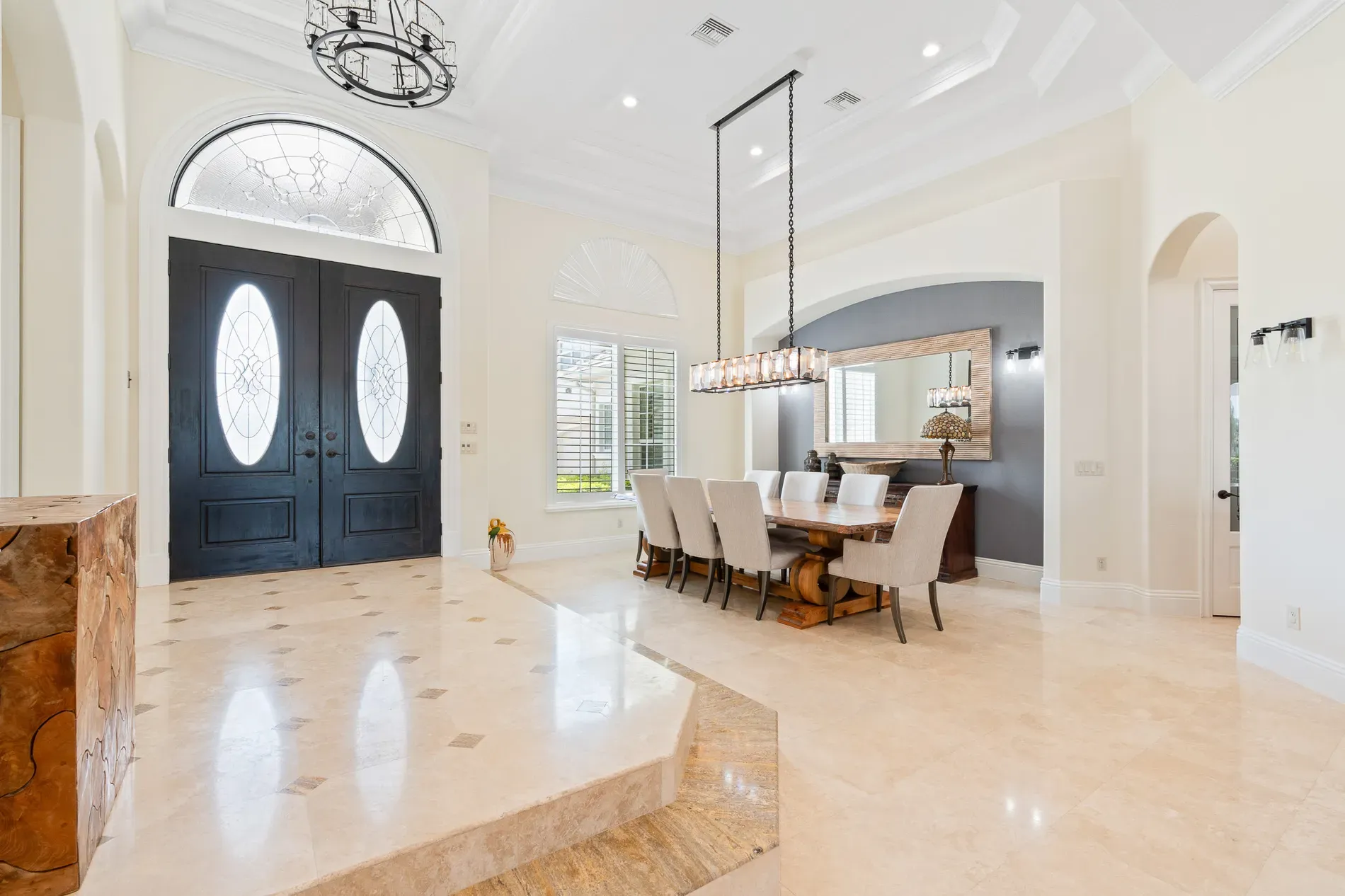 Entry pops with blue doors and glass. Fancy, but welcoming.