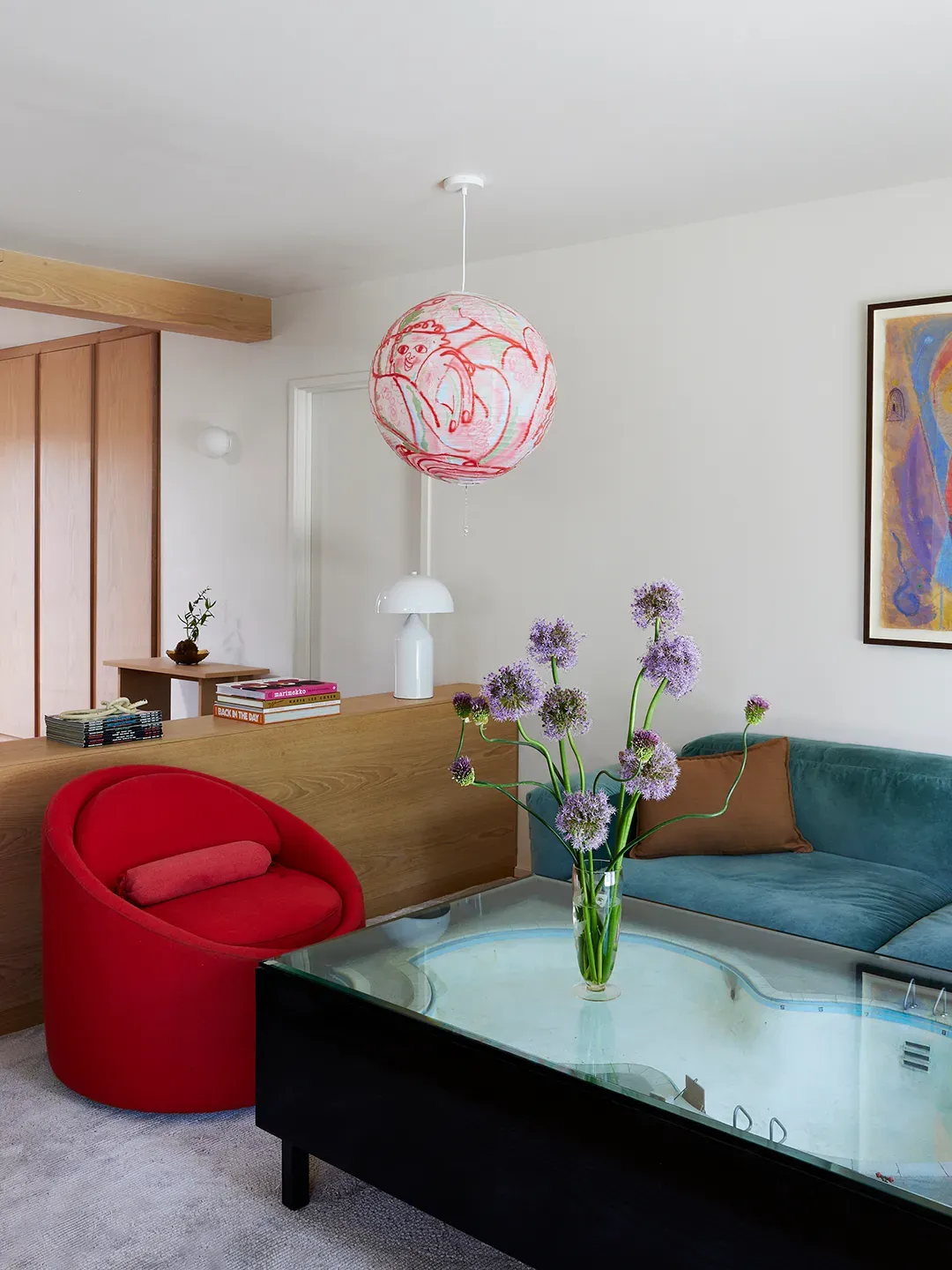 Another angle — teal sectional plus a round red chair. Color math checks out.