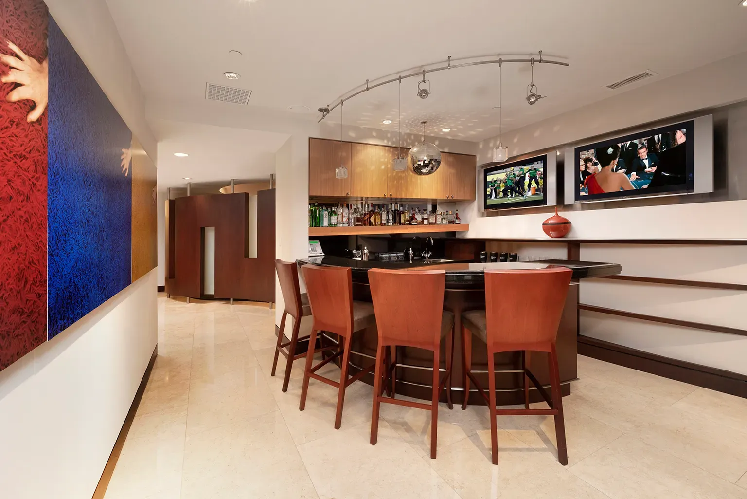 Bar zone—dark stone top, shiny floor. Feels hotel chic, in a good way.