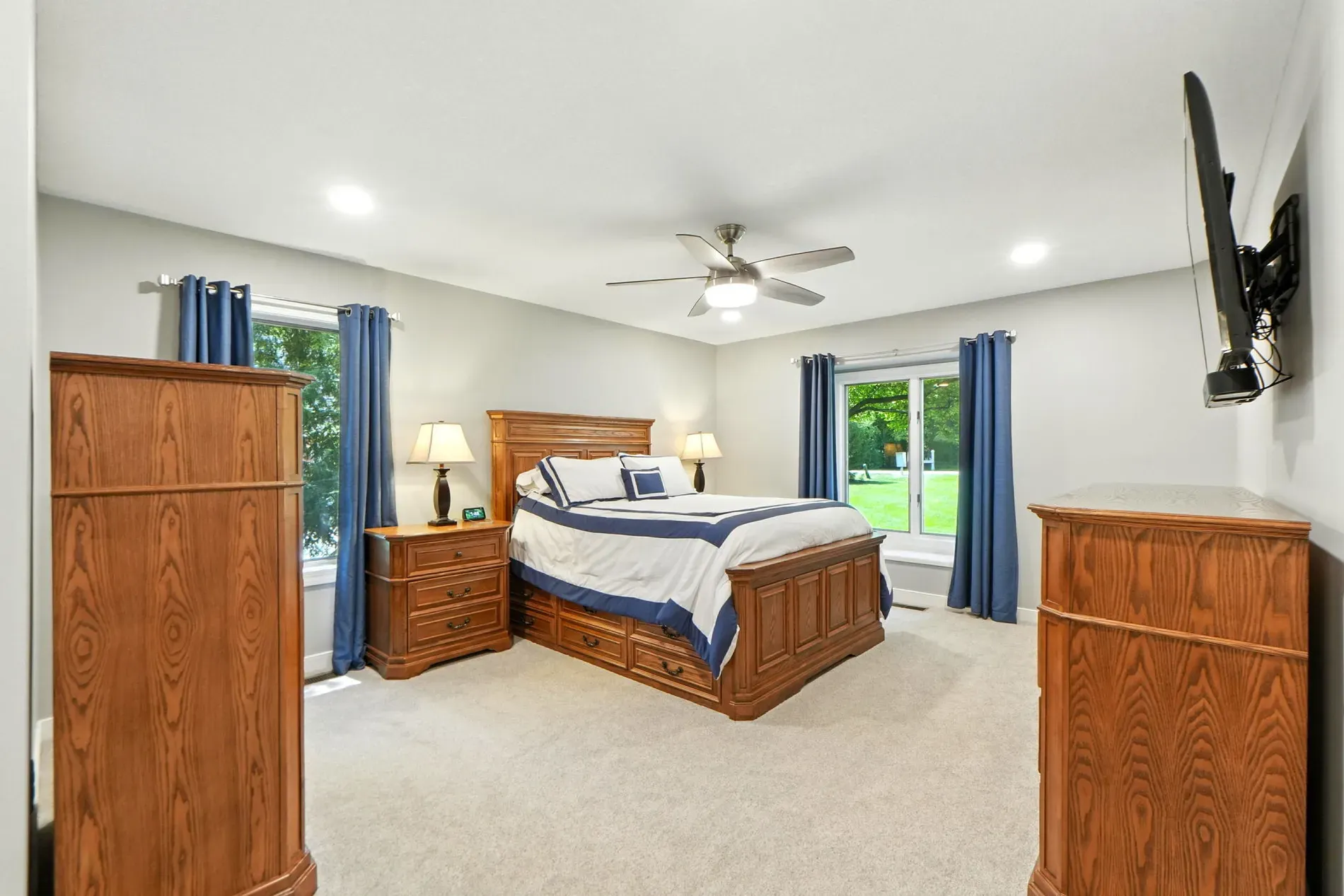 Primary bedroom leans traditional. That bed frame is doing the most.