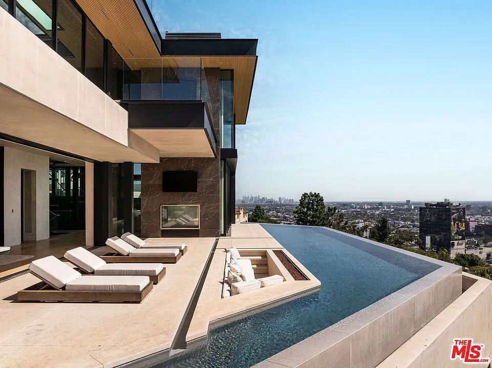 From this angle, the pool meets the sky. Stone deck, plenty lounge space.