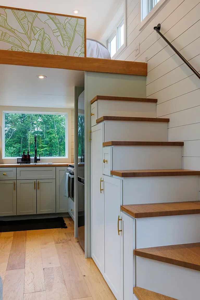 Love the wood treads next to the built-in cabinets. Subtle gold pulls.