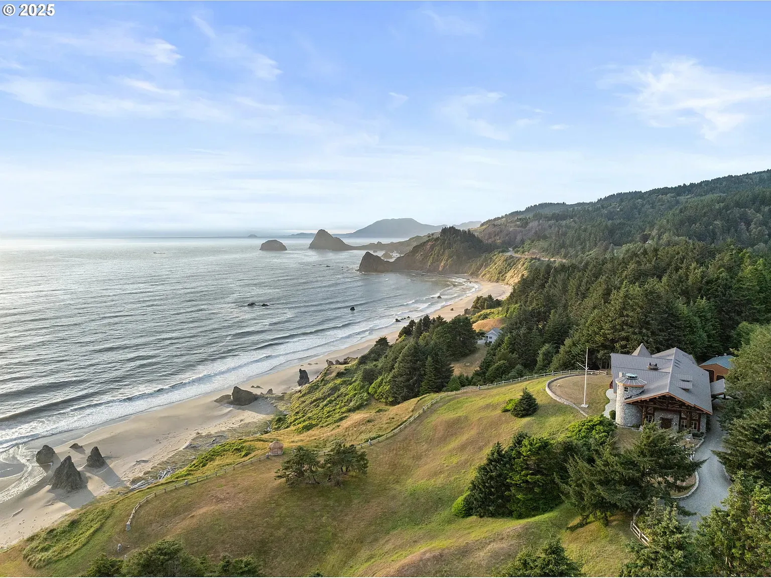 That coastline is unreal. House basically sits on a postcard.