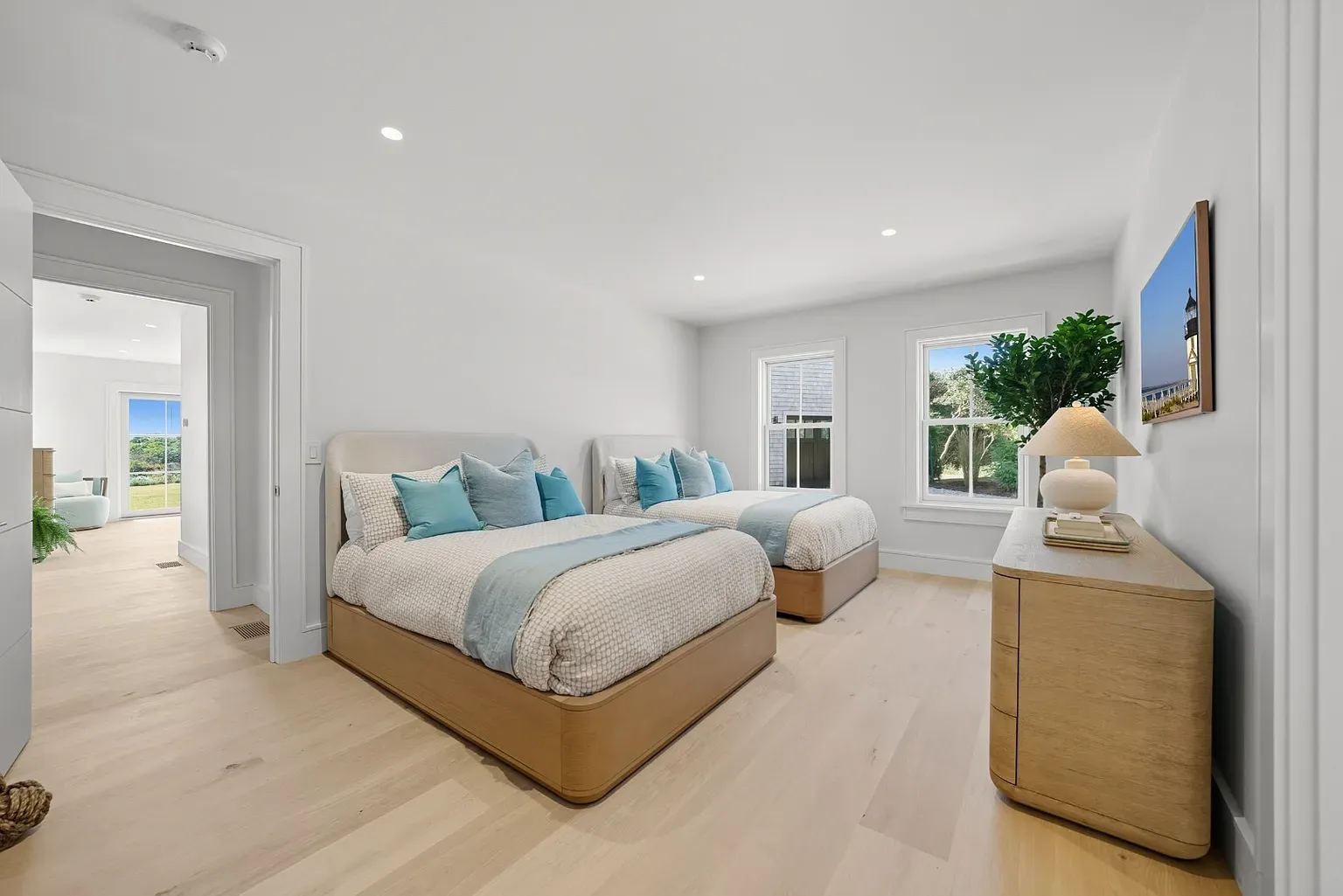 Another bedroom, super airy. Light floors, barely any stuff. Respect.