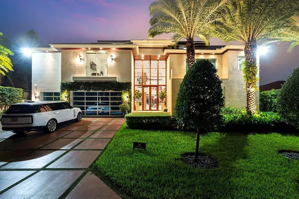 Front elevation. clean stucco, big glass, palm-shadow vibes. Entry feels dramatic.