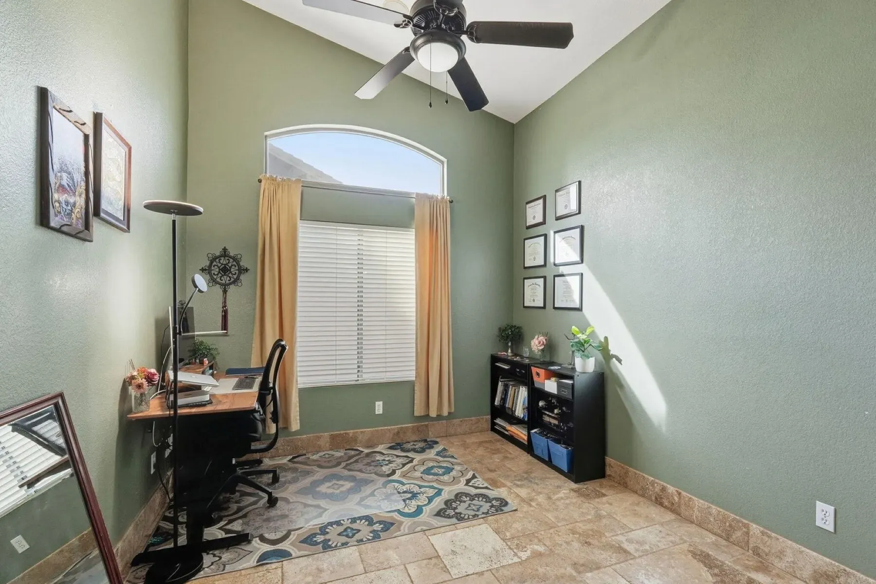 Vaulted office with a huge arched window. Light for days.
