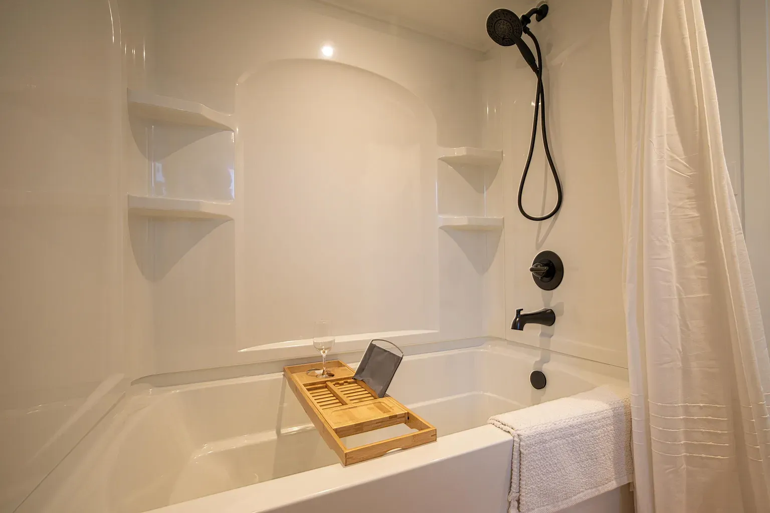 Matte black against glossy white always works. Tub looks new-car shiny.