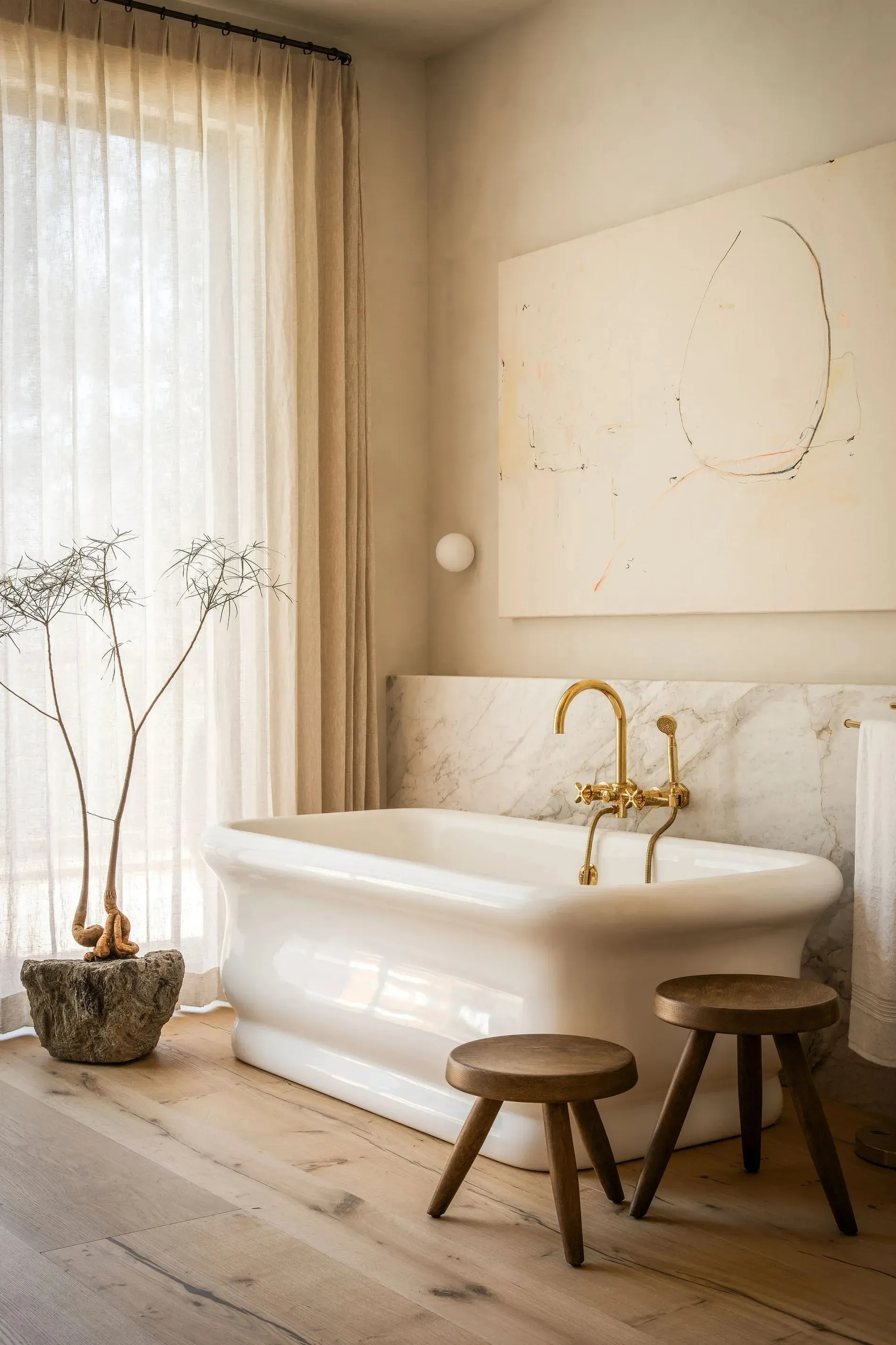 That tub is sculpture. The veined wall behind it steals the show.
